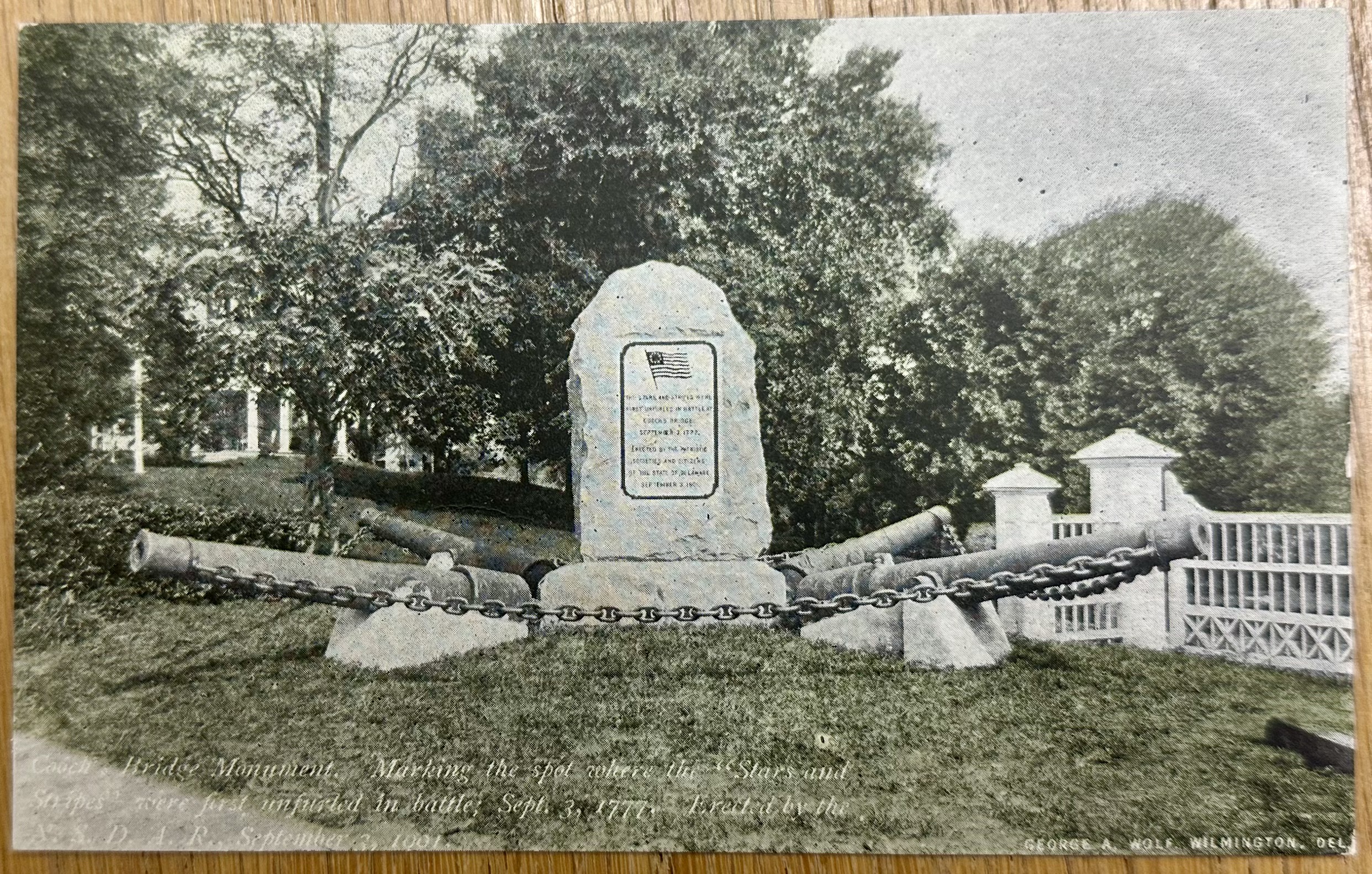 “Cooch’s Bridge Monument. Marking the spot where the “Stars and Stripes” were first unfurled in battle; Sept. 3, 1777. Erected by the N.S.D.A.R. September 3, 1901.”